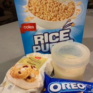 Condensed Milk Oreo Fudge Ingredients - a box of rice bubbles, a packet of oreos, a bag of white chocolate chips and a container of condensed milk