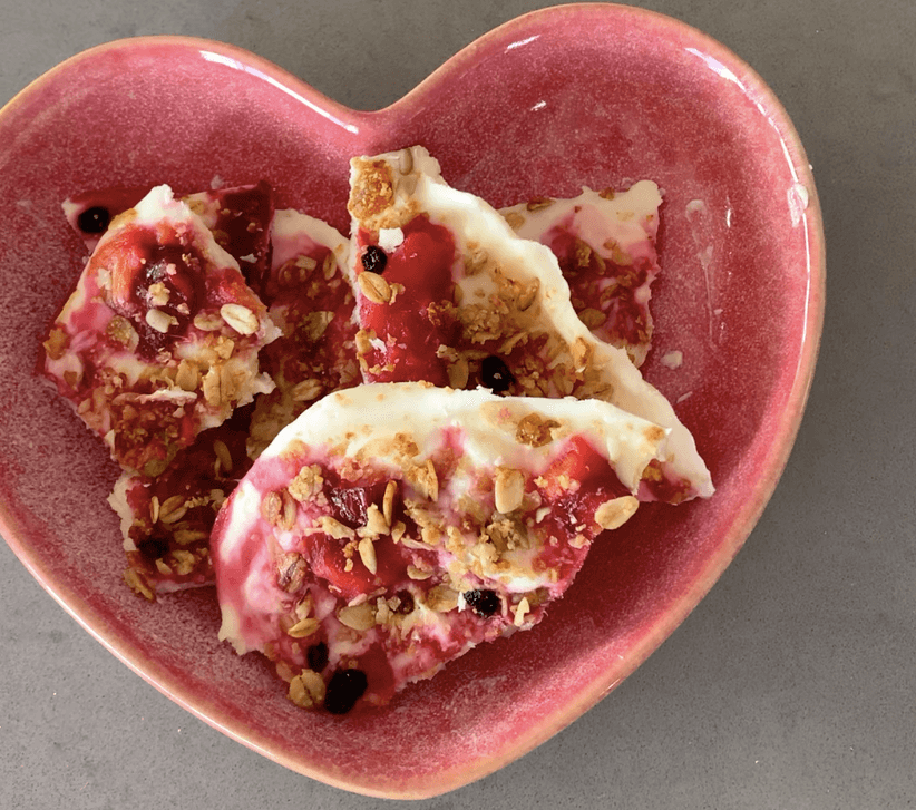 Yoghurt Bark broken up in a pink love heart shaped bowl