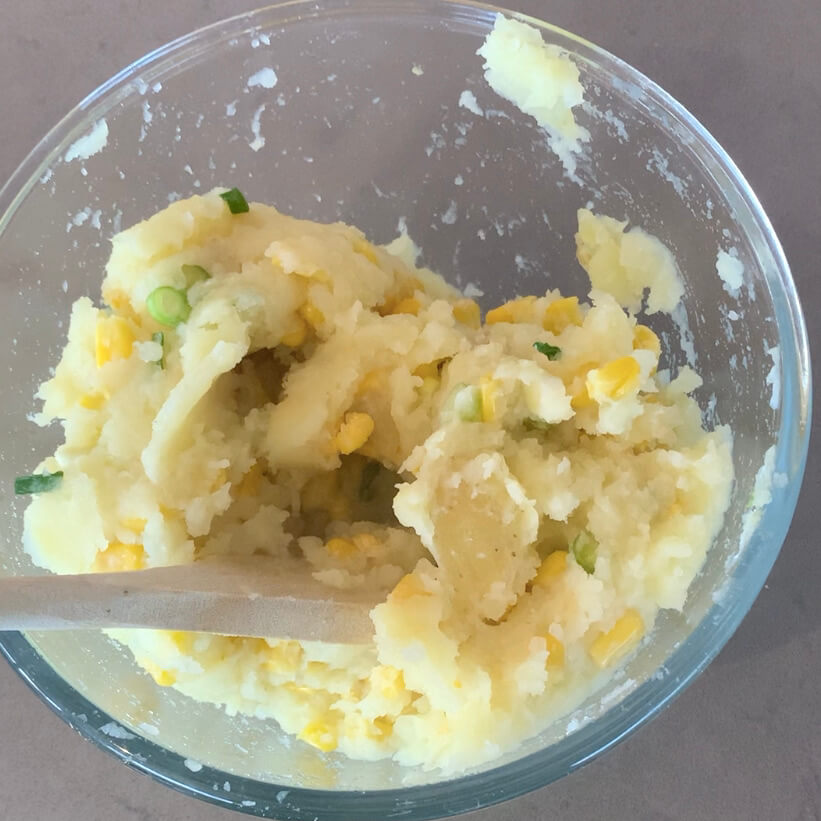 Mashed potato with corn and spring onions