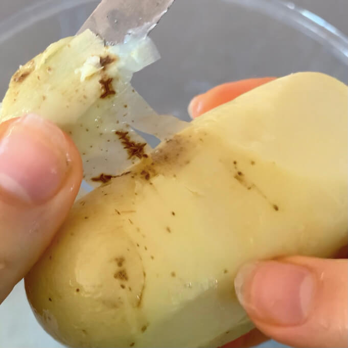 Peeling a cooked potato