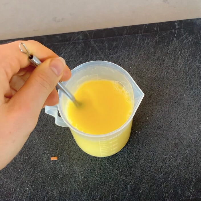 Whisking egg in a small jug
