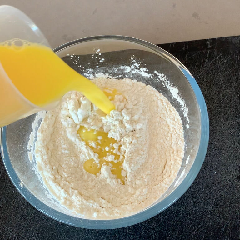 Pouring wet into dry ingredients