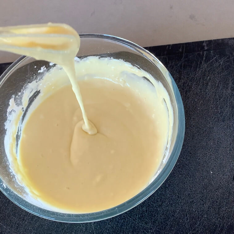 Whisking batter in a glass bowl