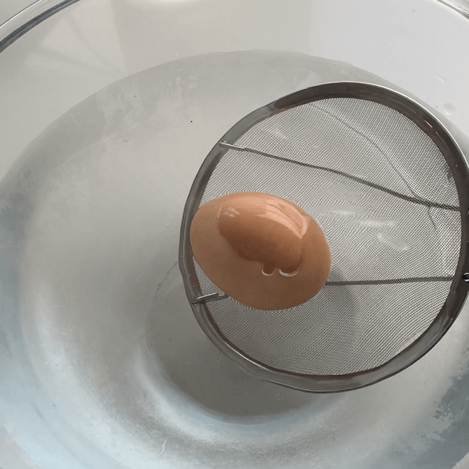 Boiled egg in iced water