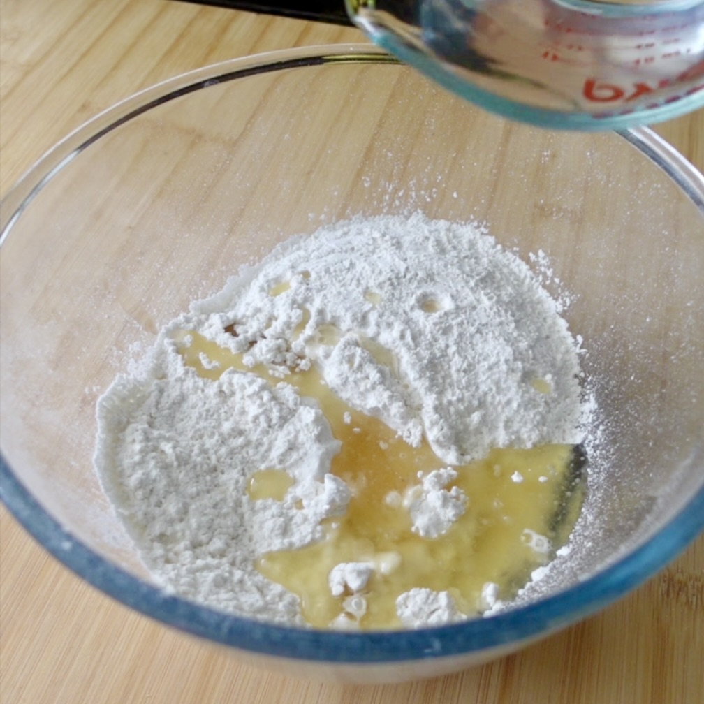 Flour, oil and water in a glass bowl