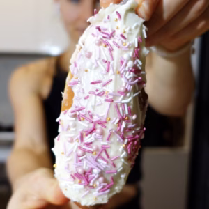 Finger bun inspired Japanese salt bread topped with white icing and pink sprinkles